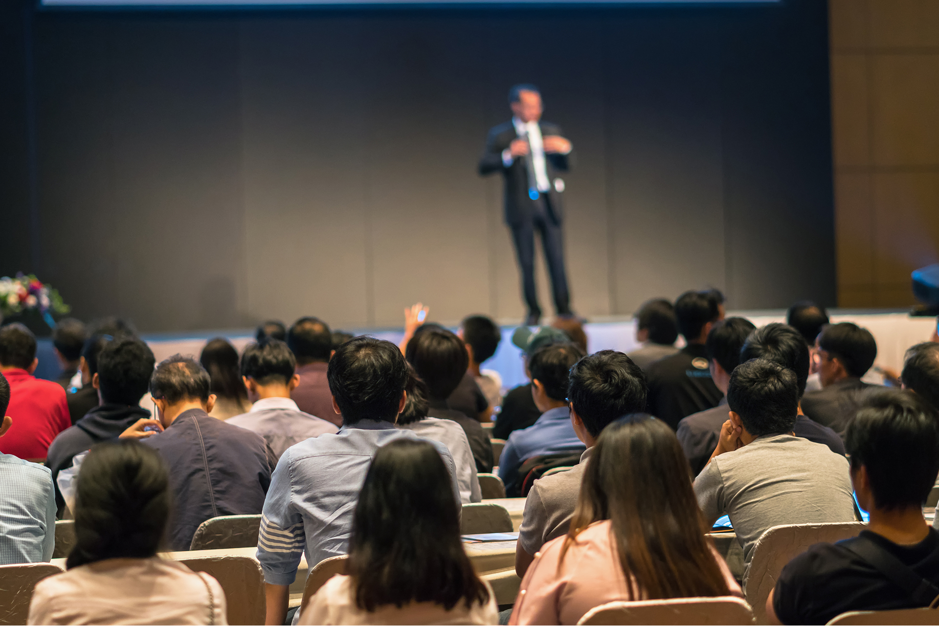 QUAL360 APAC 2026 – speaker presenting to a business conference audience