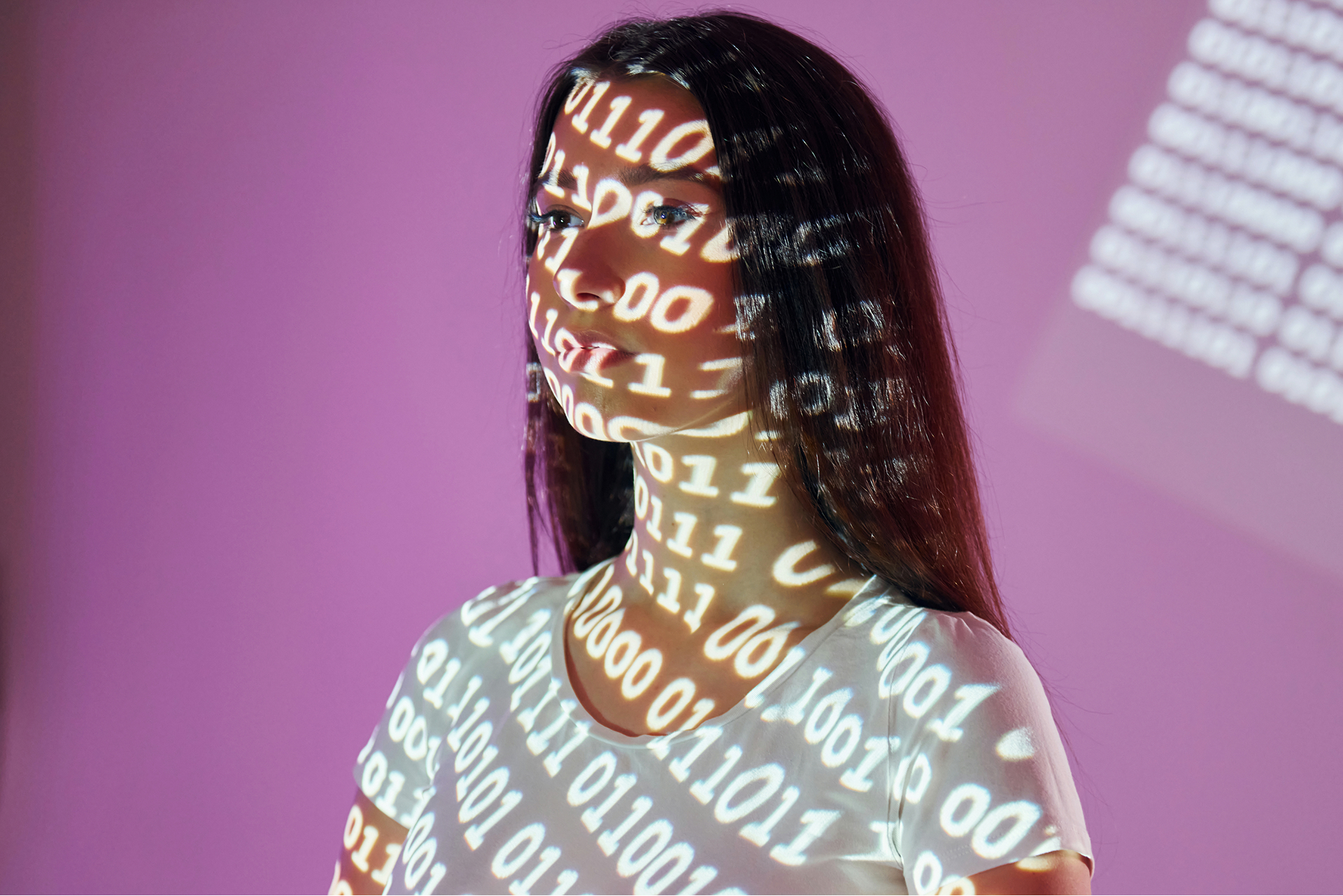 Synthetic research participants – woman with binary code projection